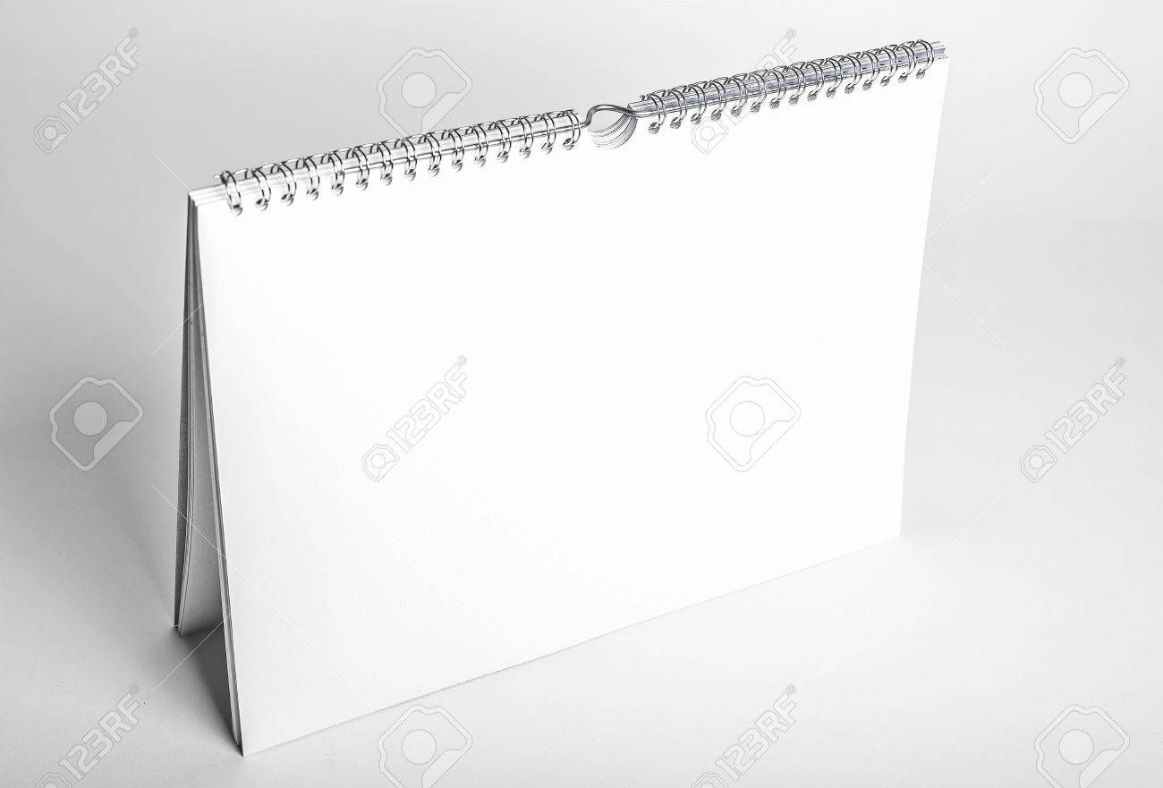 white blank calendar mockup with spiral binding seen from above